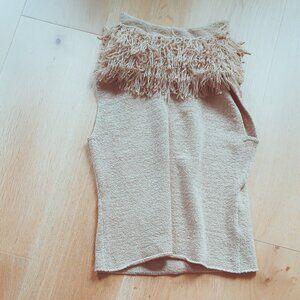 Fringes and bare arms for winter! Great texture & fit.